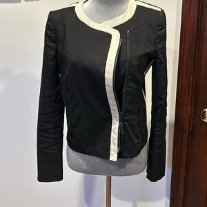 Black DKNY jacket with side pockets made of ramie and viscose.
